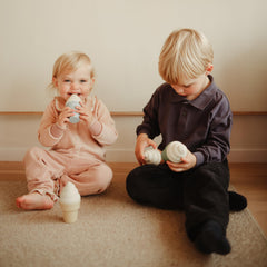 Handheld size Mushie ice cream figures for small grip practice.