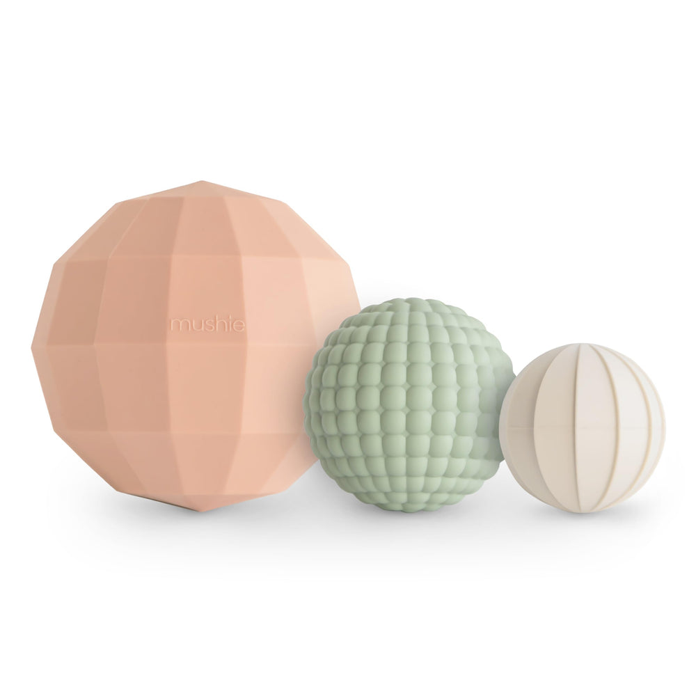 Mushie silicone nesting spheres Blush assembled for tactile sensory play and stacking