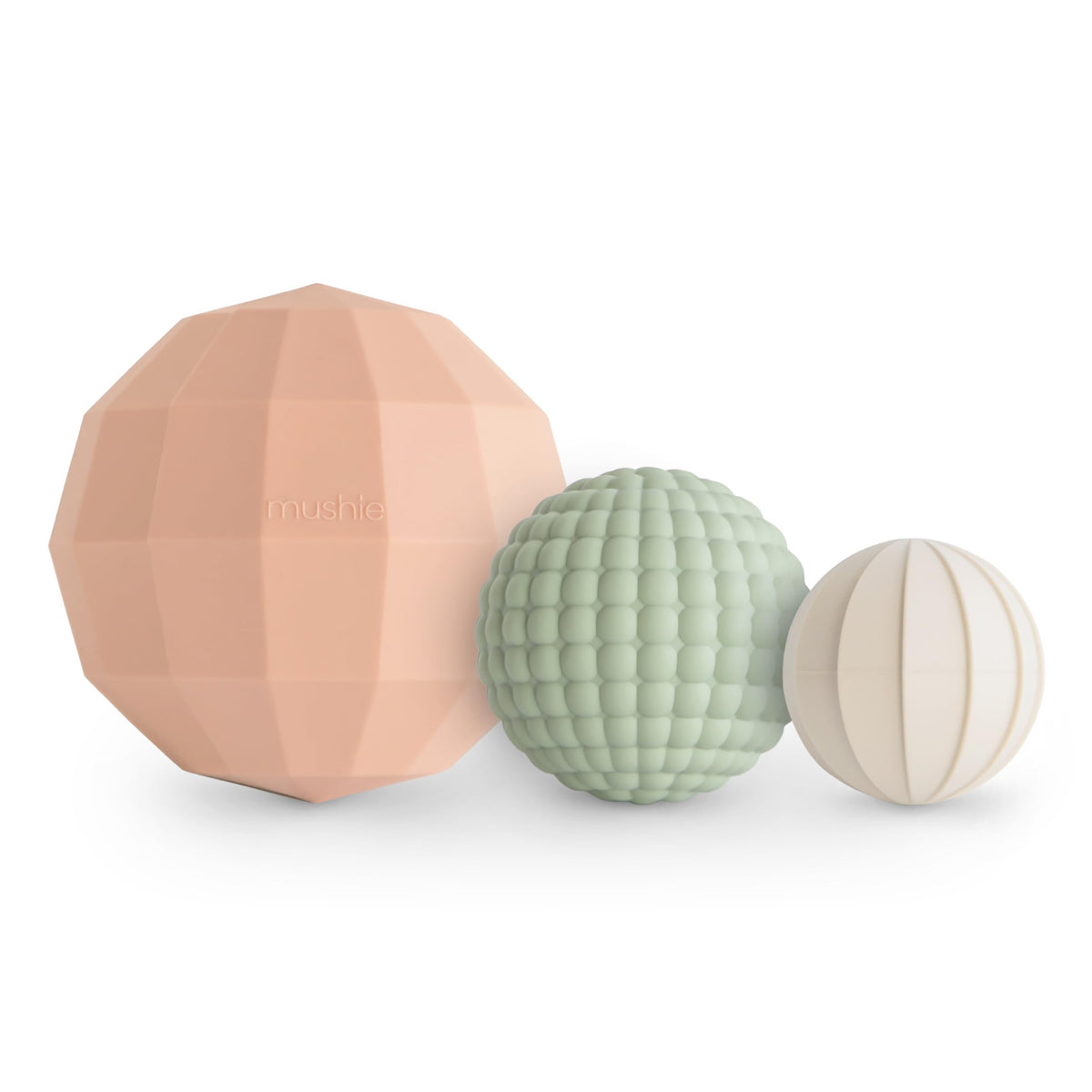 Mushie silicone nesting spheres Blush assembled for tactile sensory play and stacking