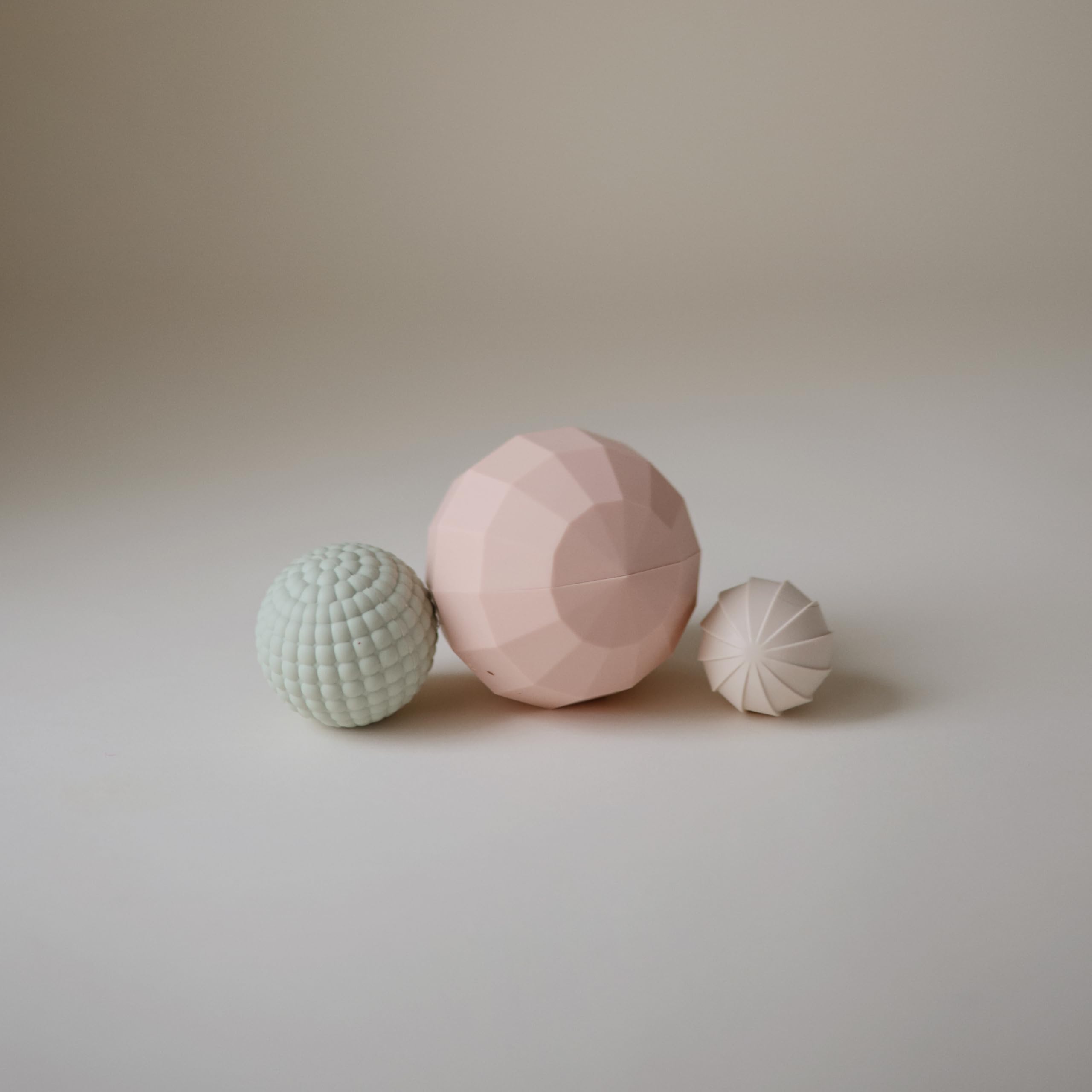 Mushie silicone nesting spheres textures promote baby sensory discovery and fine motor practice