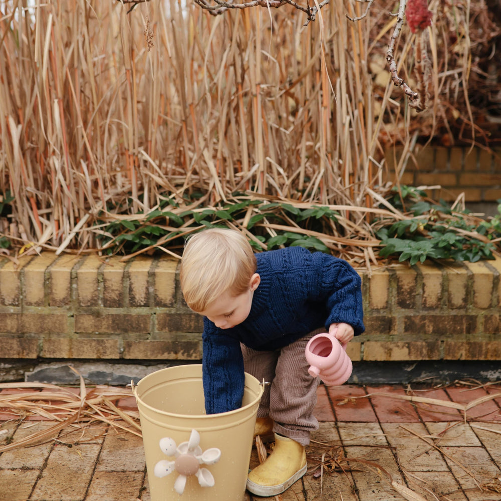 Mushie silicone watering can suitable for bath and garden activities in blue