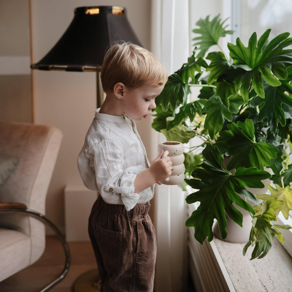 Mushie silicone watering can kid-friendly design for pretend gardening