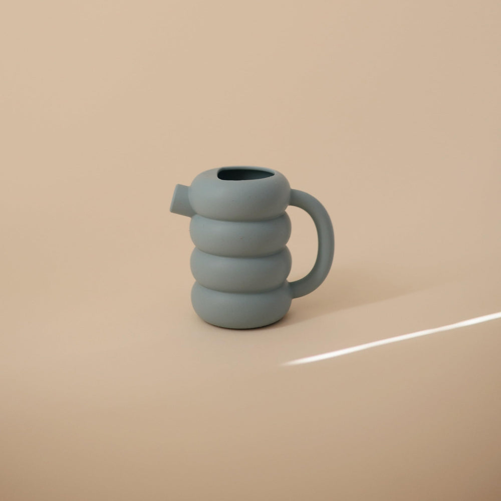 Mushie silicone watering can lightweight design supports little hands