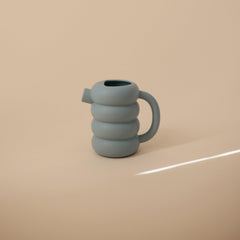 Mushie silicone watering can lightweight design supports little hands