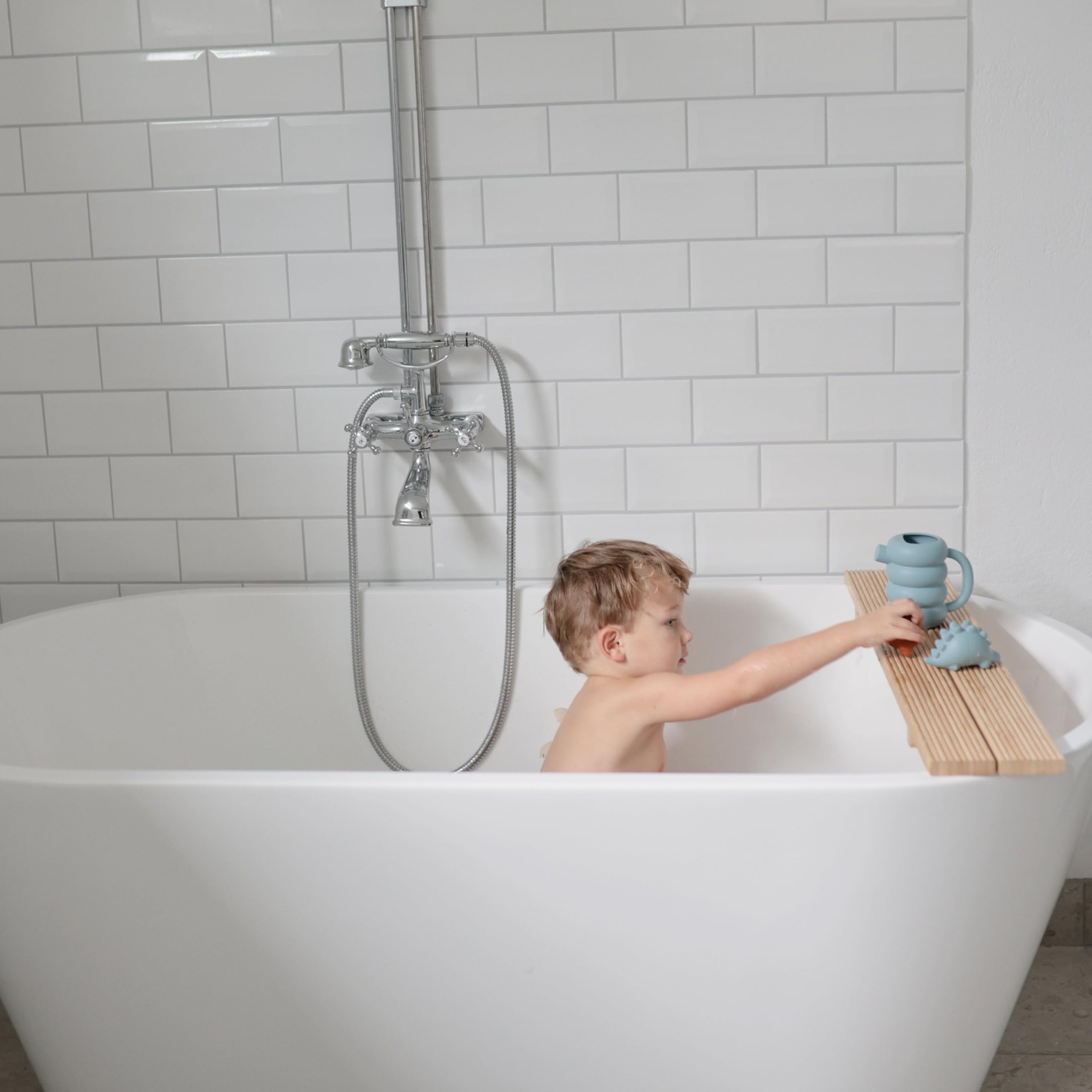 Mushie silicone watering can provides soft tactile feel for toddlers