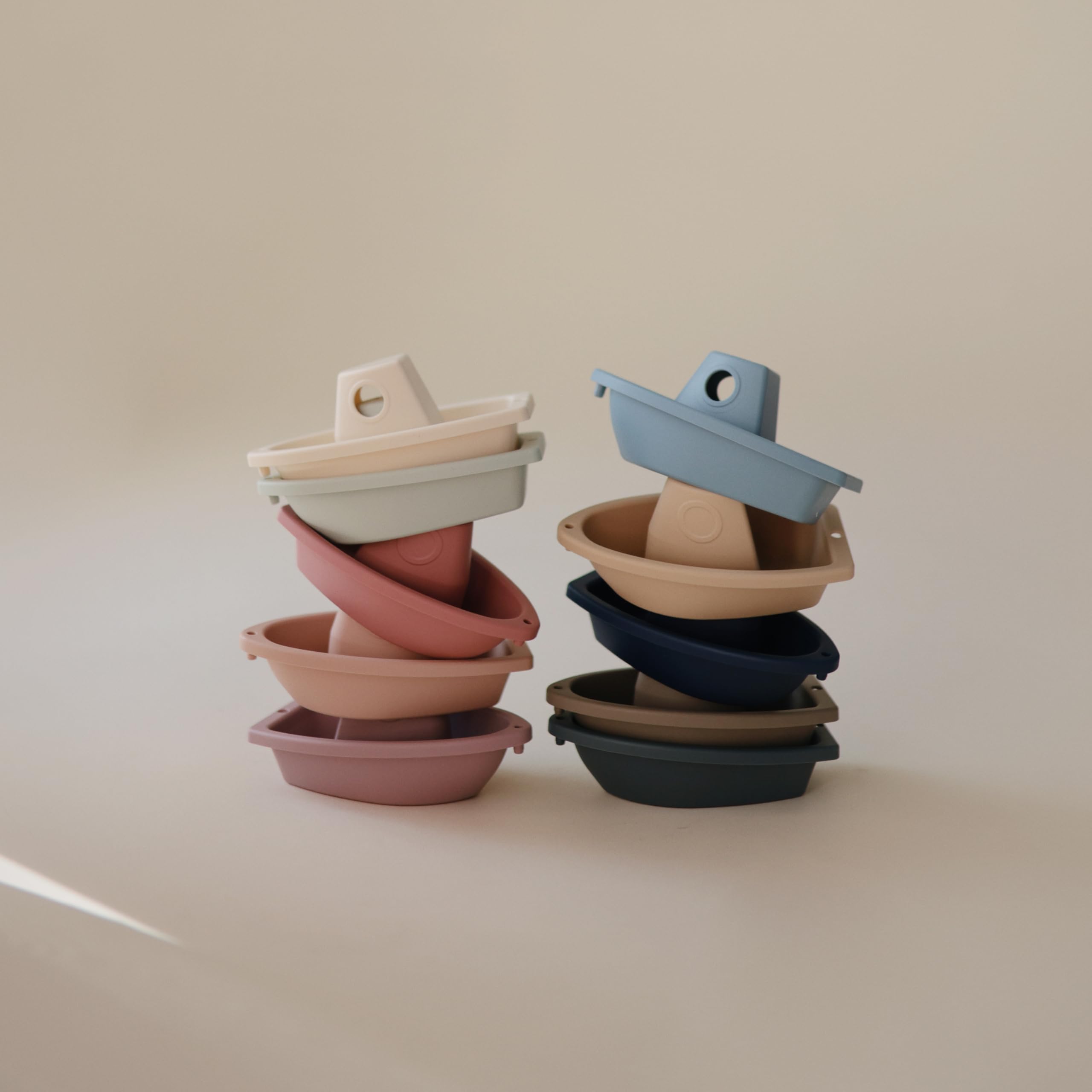 Mushie Ocean boats linked together form a floating train during bath.