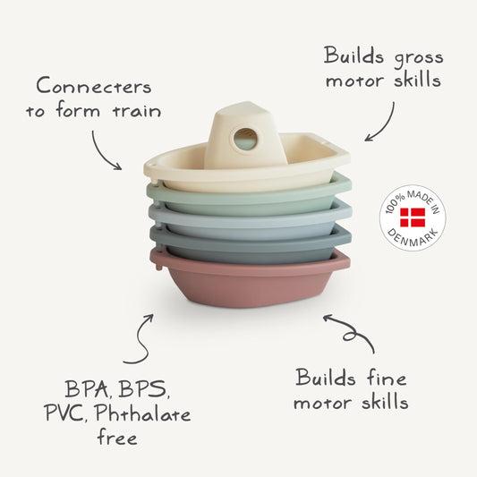 Mushie Stackable Bath Boats Petal 02 linked to form a floating train, promoting sequencing.