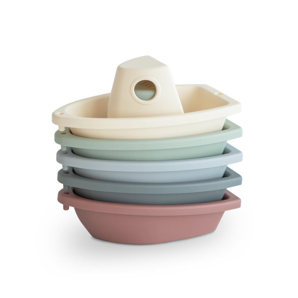 Mushie stackable bath boats train for imaginative bath play.