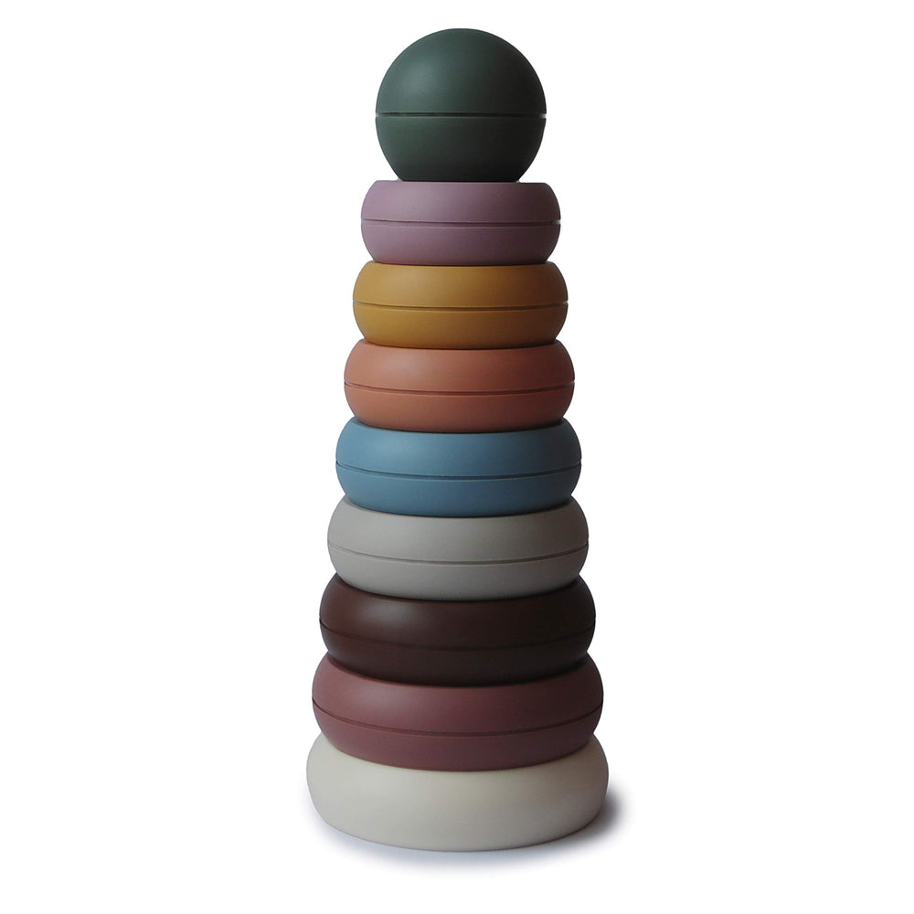Mushie stacking rings in rustic colors promote fine motor play and early problem-solving