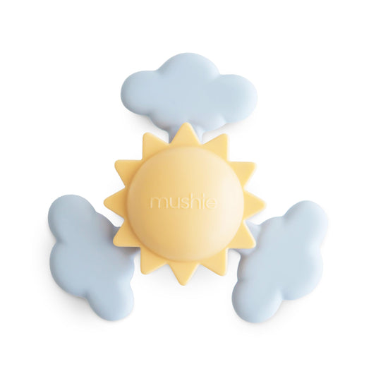 Mushie Sunshine Suction Spinner Toy on bath rim for engaging playtime