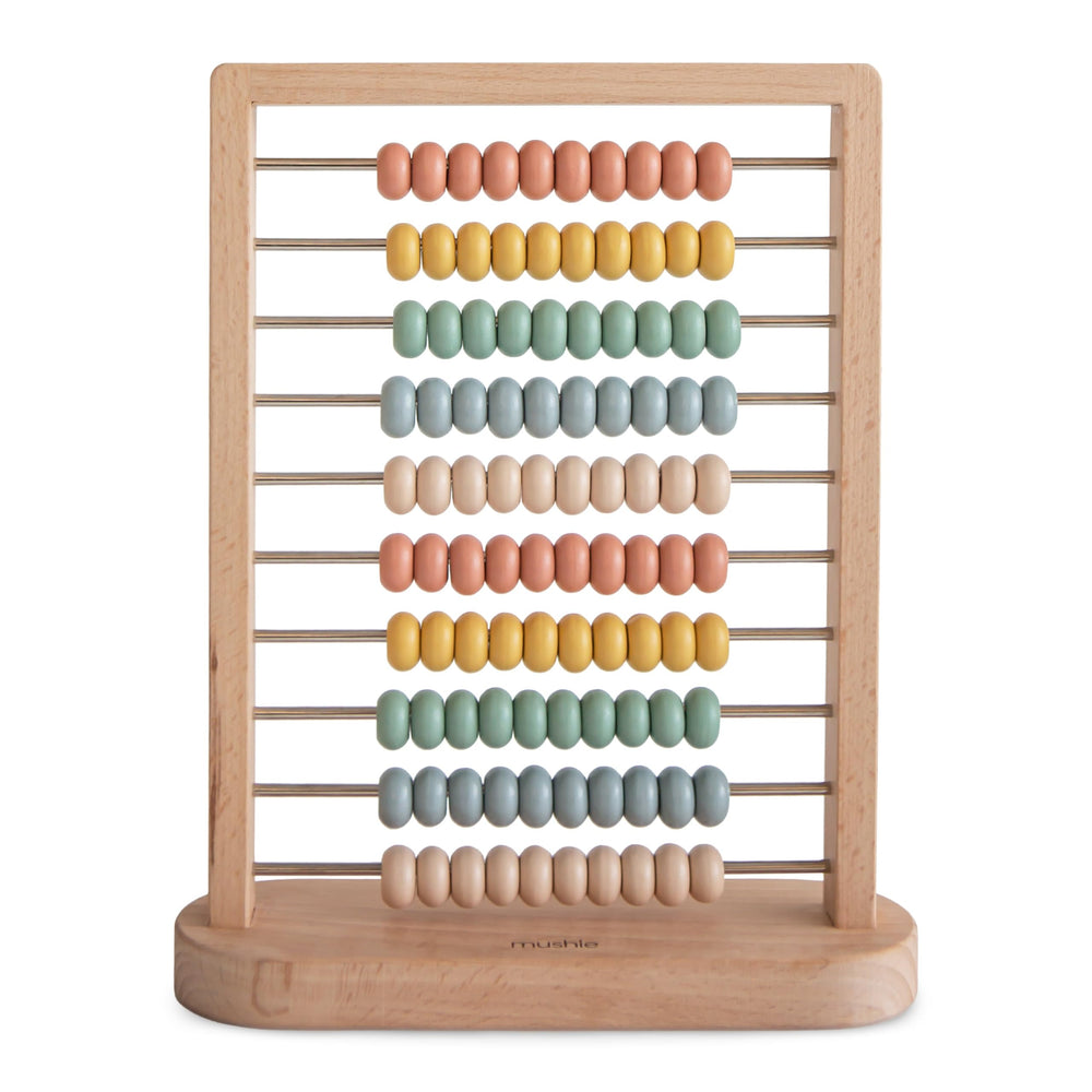 Mushie wooden abacus beads glide smoothly for counting and color sorting.
