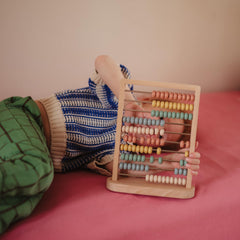 Mushie abacus features child-safe paint for worry-free play.