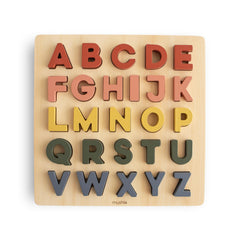 Mushie wooden alphabet puzzle front view for early literacy exploration.