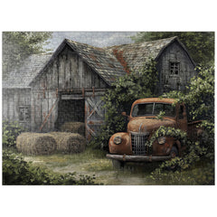 MyPuzzle Weathered Barn with Classic Rusty Truck puzzle image on table for family fun