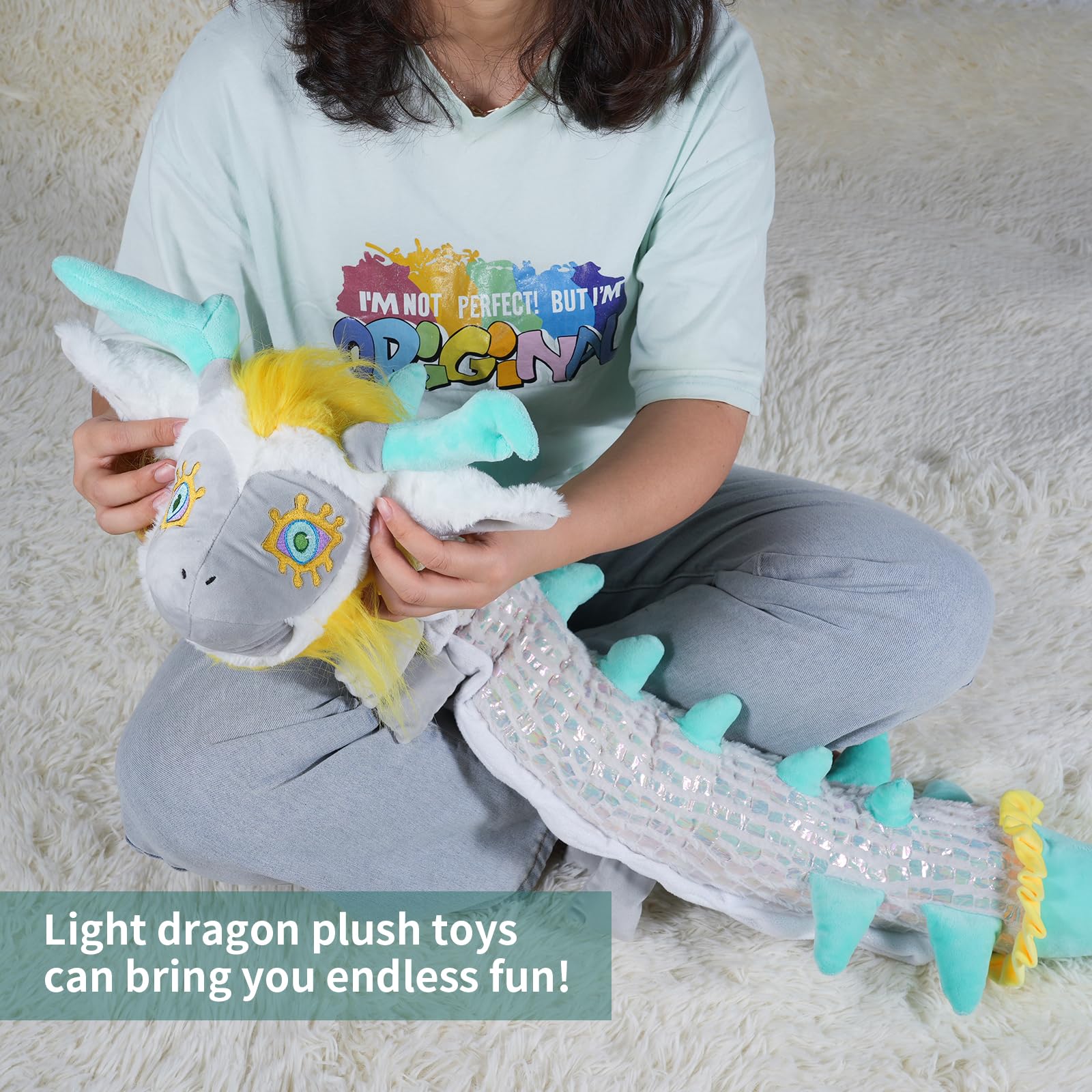 Nadou Light Dragon Plush Pillow used as bedroom decor and comfy seating aid.