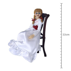 Interchangeable heads let NECA Annabelle vary expressions for display