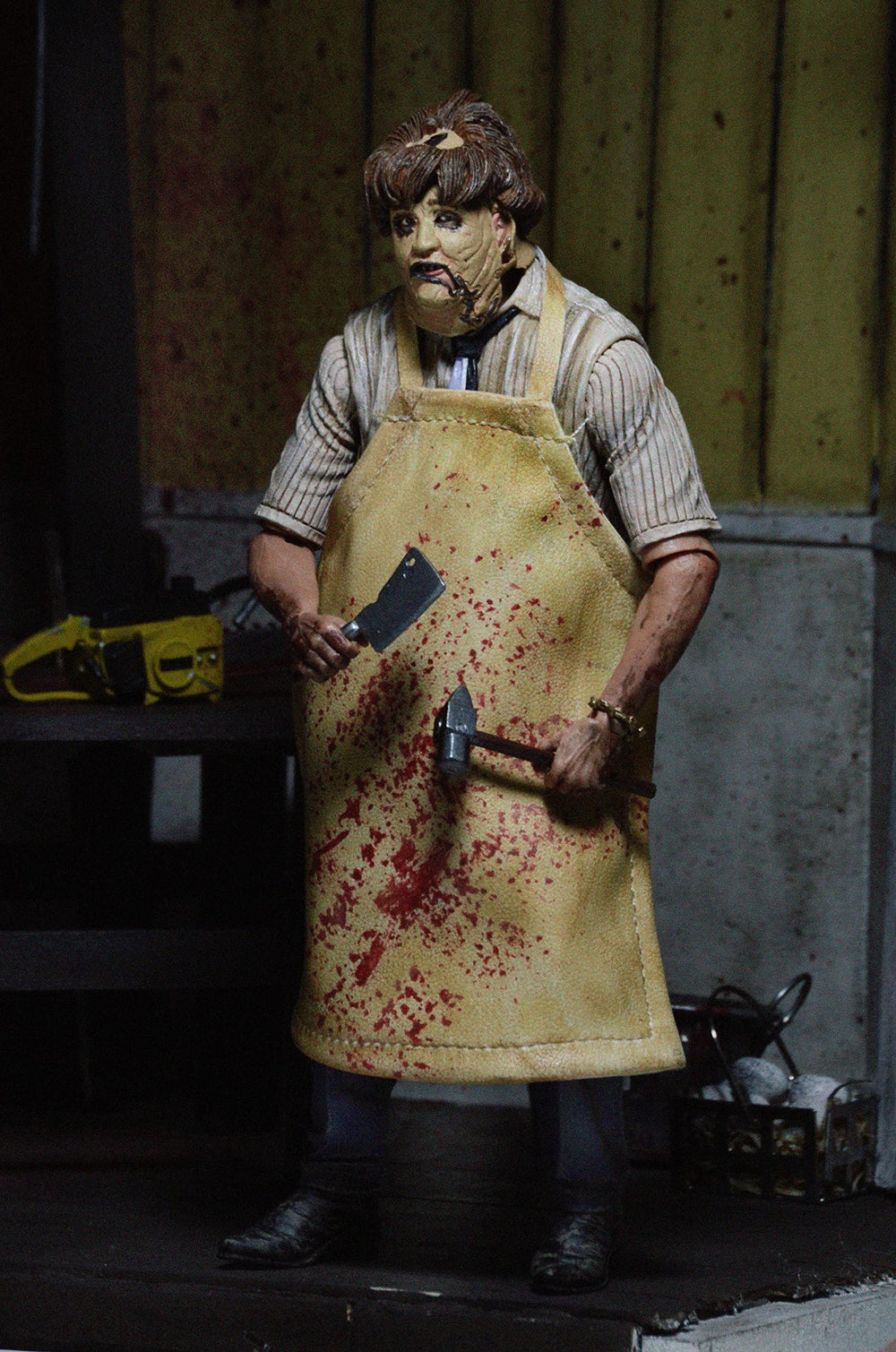 NECA Leatherface 1974 chainsaw accessory highlighting authentic weapon prop for display.