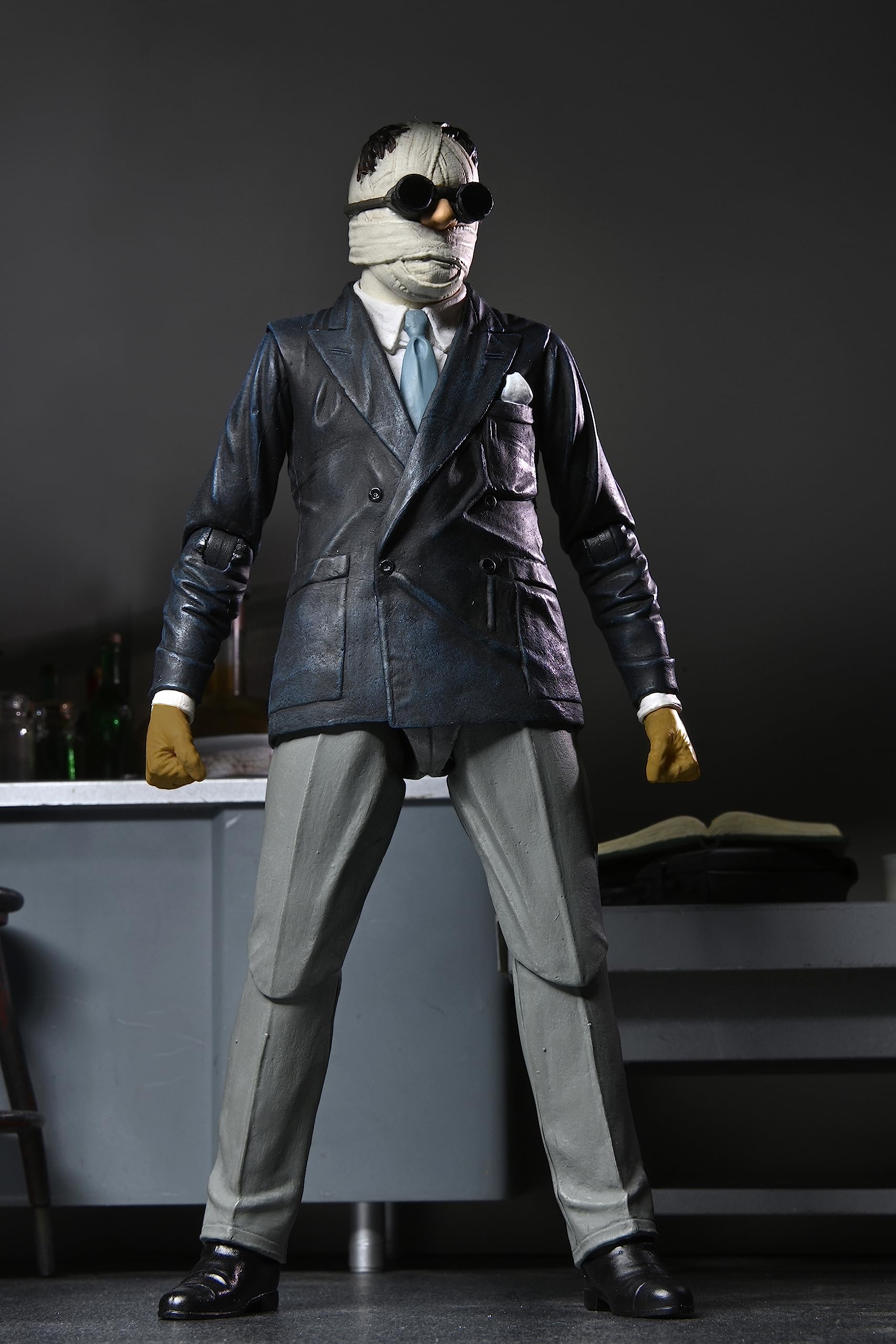 NECA Invisible Man 7-inch figure in window display packaging.