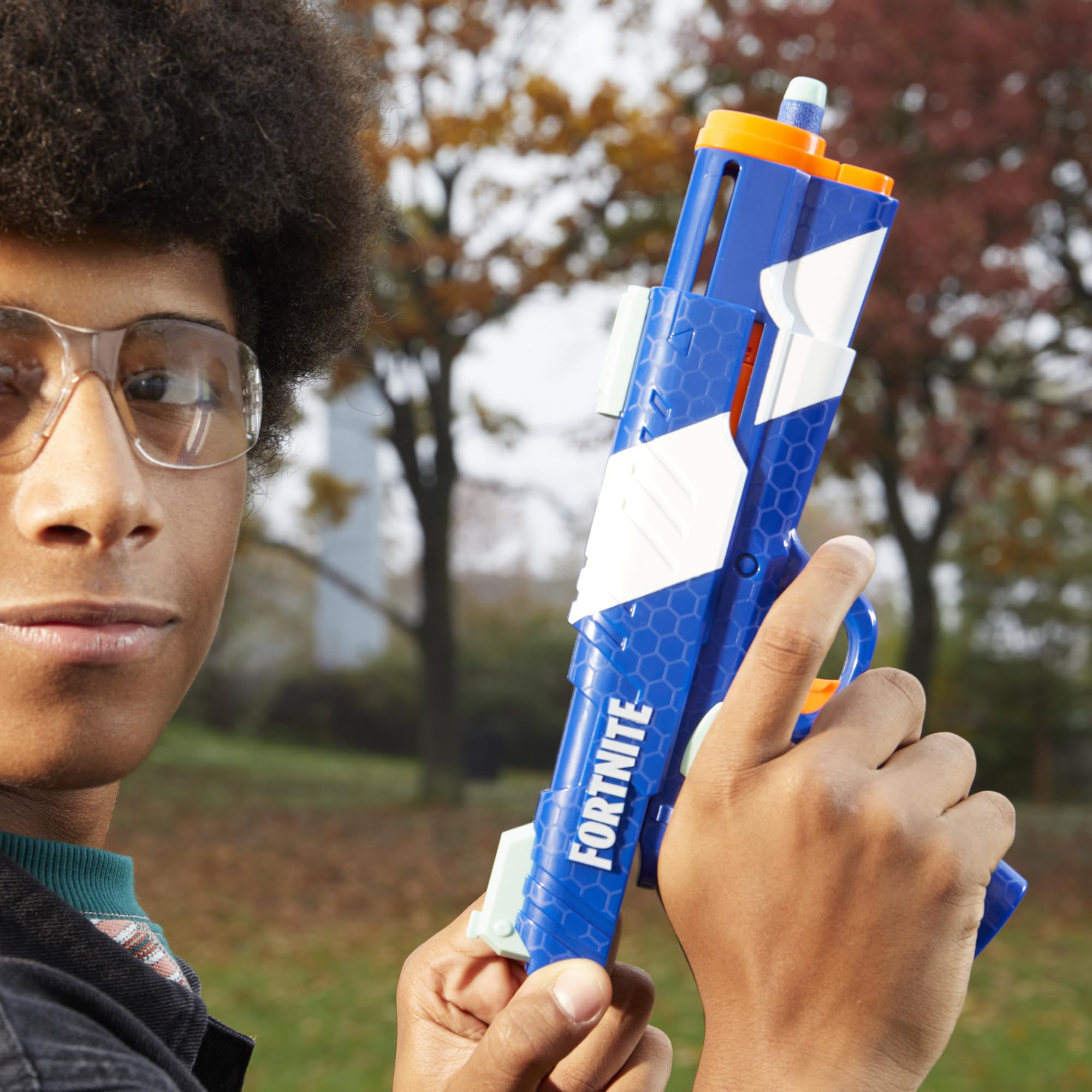 Nerf Fortnite dual pack action shot demonstrates outdoor duel setup.