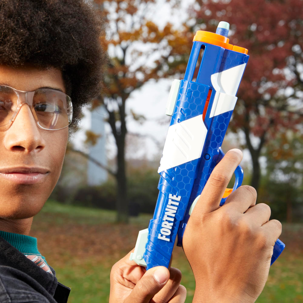 Nerf Fortnite dual pack action shot demonstrates outdoor duel setup.