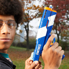 Nerf Fortnite dual pack action shot demonstrates outdoor duel setup.