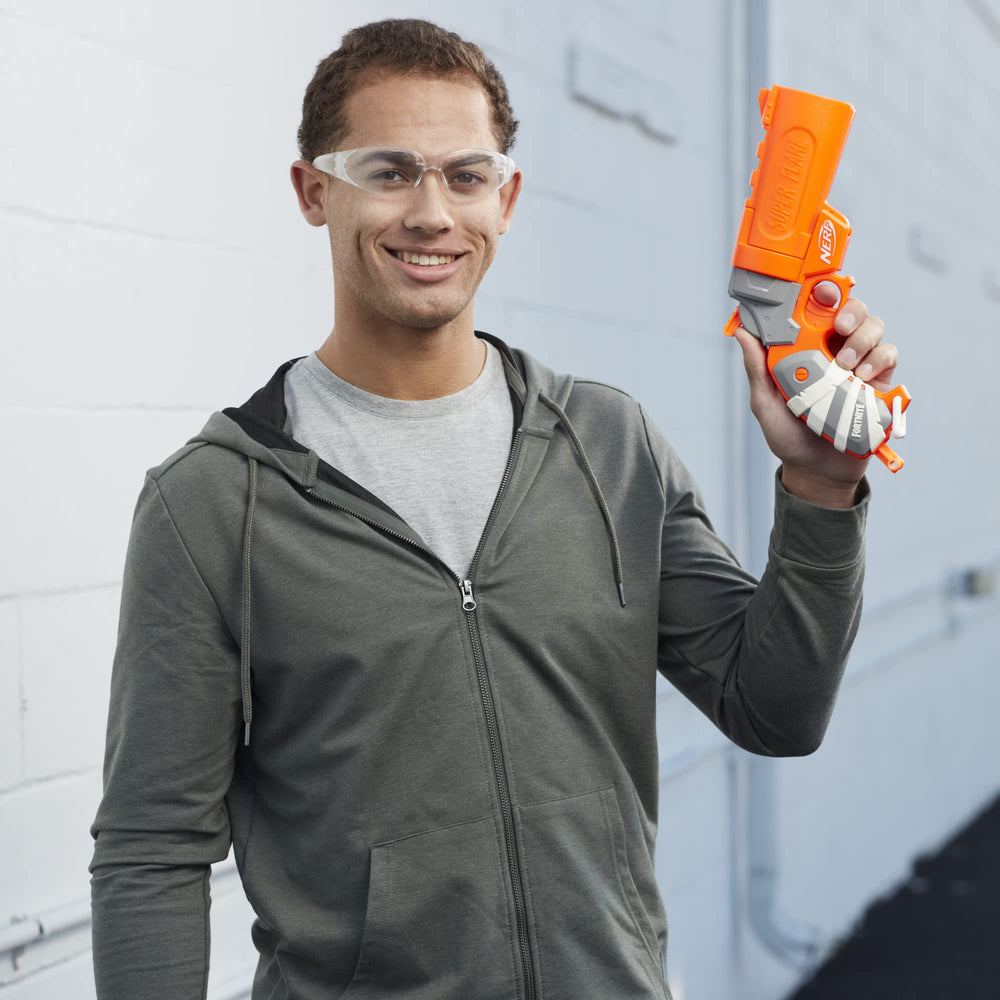 Nerf Fortnite Flare blaster held in action during indoor play