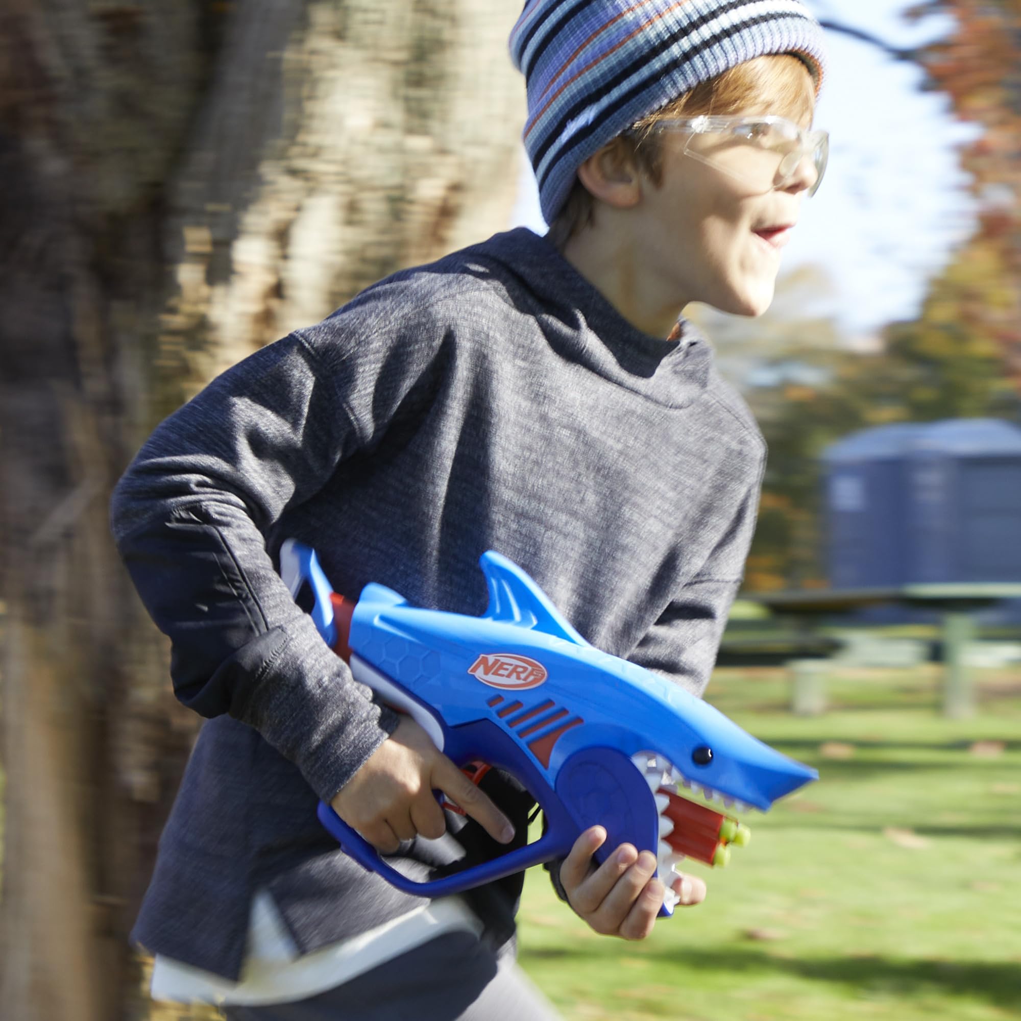 Nerf Junior Wild Sharkfire kid hand holding blaster during play.