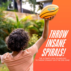 Child holding spiral-grip football ready for backyard play with Nerf logo.