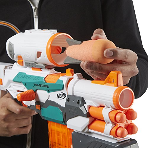 Nerf Modulus Tri-Strike backyard-battle-scene with friends and foam darts.