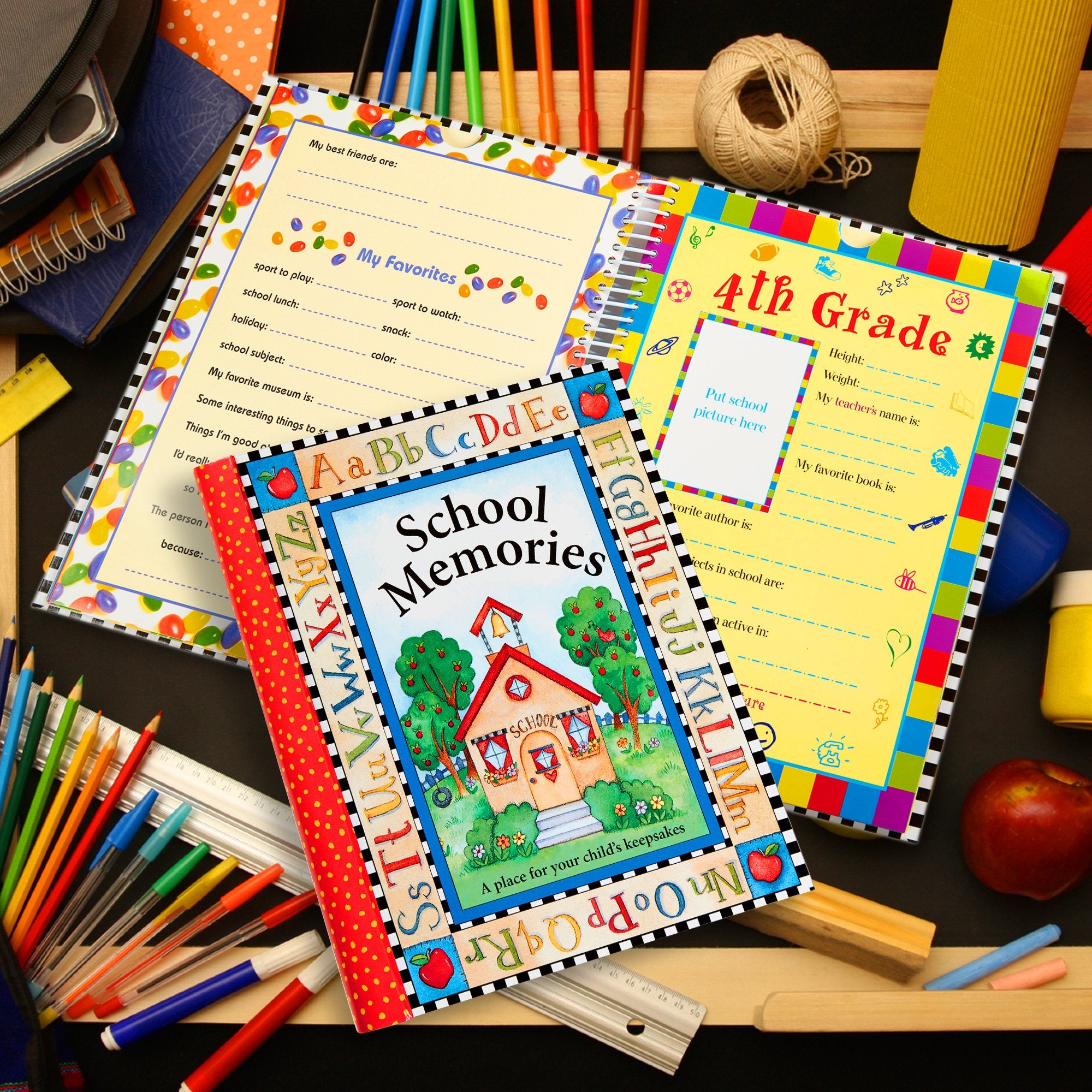 New Seasons deluxe keepsake album inside spread highlighting grade-by-grade sections