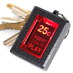 New Wave Toys RepliCade Insert Coin Keychain with LED coin return in action.