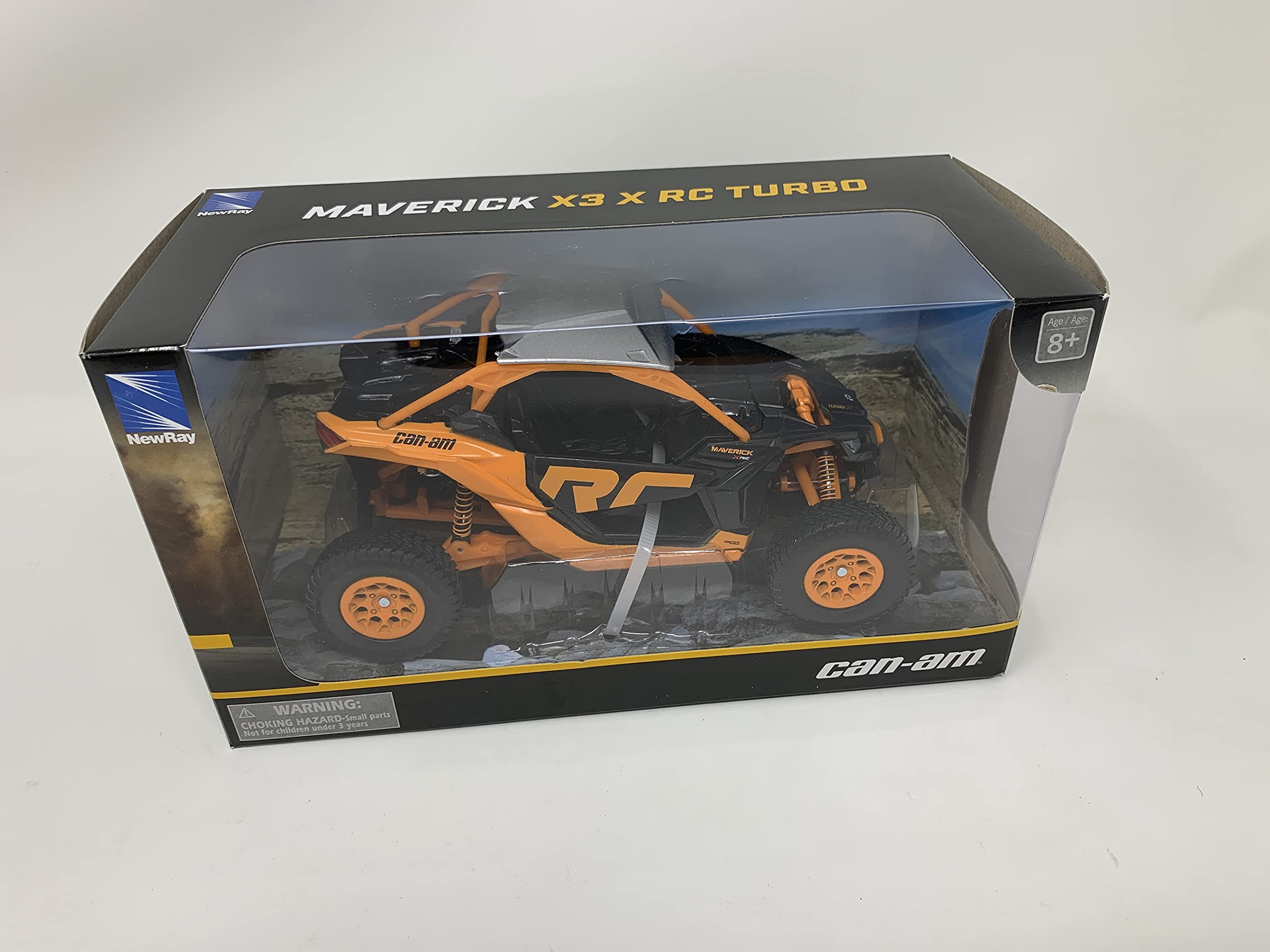 NewRay Can-Am Maverick X3 XRC Turbo ATV orange and black wheel close-up reveals rubber tires.