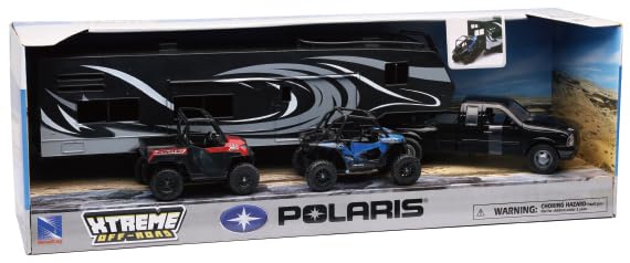 Polaris RZR and Ranger inside toy hauler with Ram Dually for display and action.
