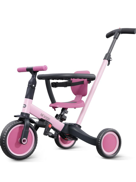 Newyoo TR008 pink tricycle front view shows sturdy build for toddlers.