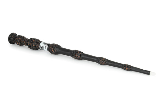 Close-up of The Noble Collection Elder Wand in hand showing the glowing tip during night play.