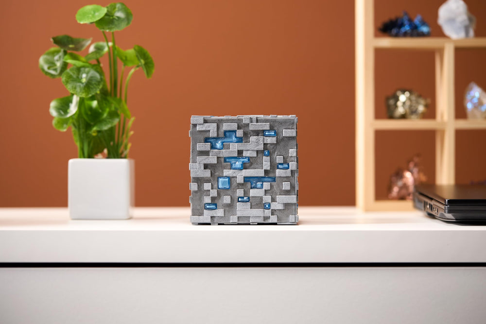 The Noble Collection Minecraft Diamond Ore illuminated detail showing the LED glow