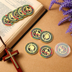 Nosiny armor of God coin in hand demonstrates portable size for pocket carry during worship or study