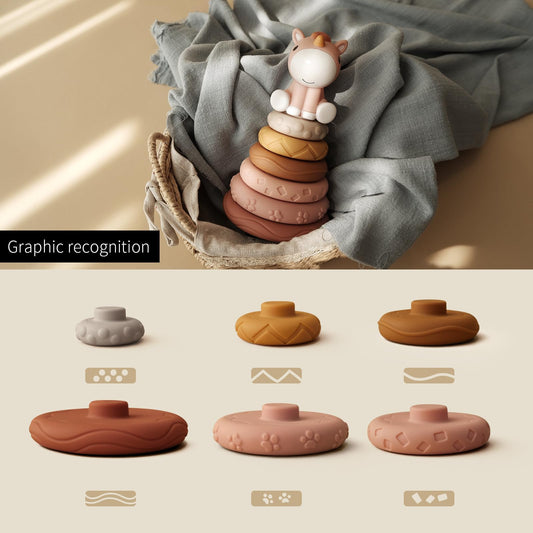 Nueplay stacking rings showing the squeaky feature to teach cause and effect.