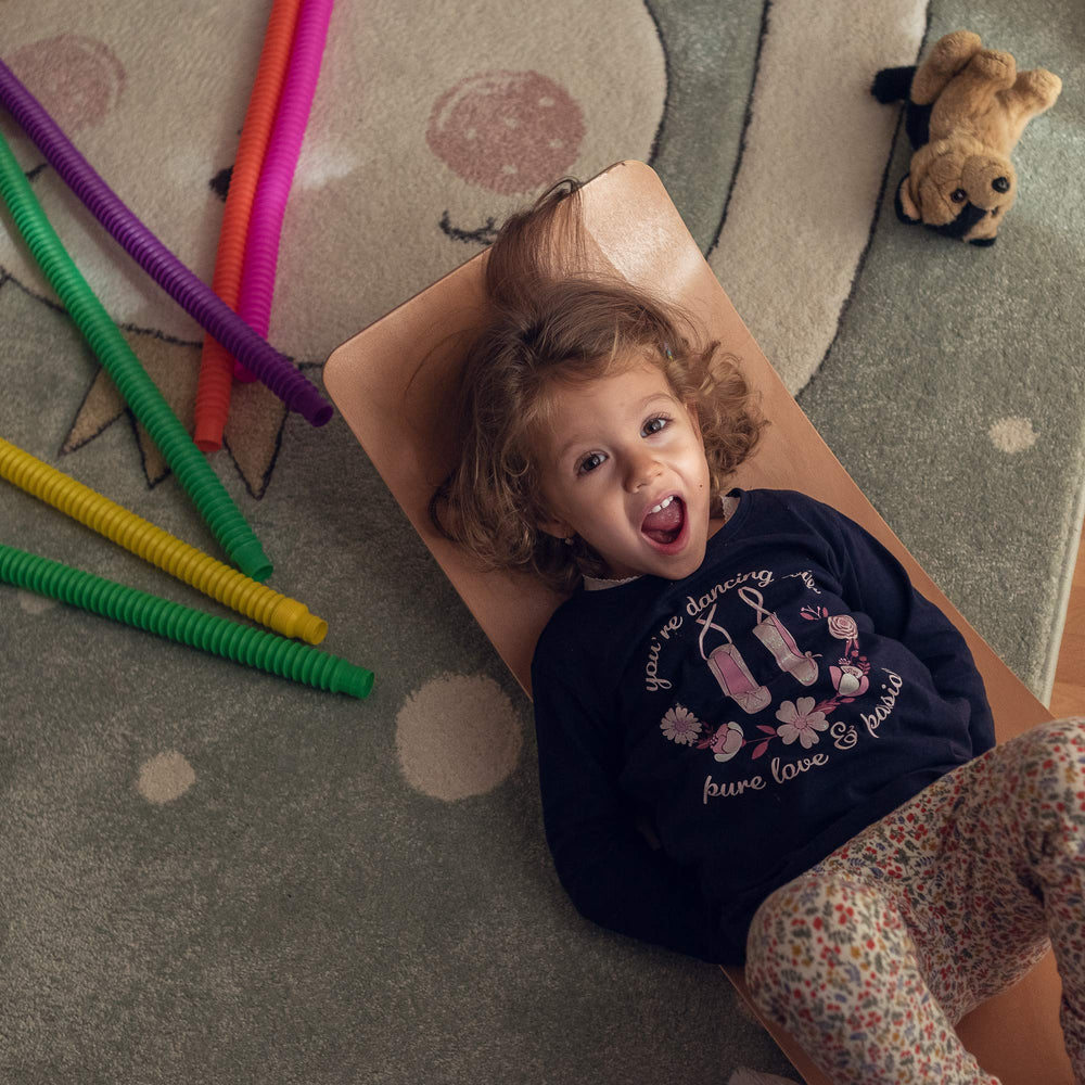 Nutty Toys wobble board kids balancing on board showcases motion and focus.