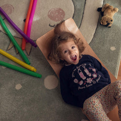 Nutty Toys wobble board kids balancing on board showcases motion and focus.