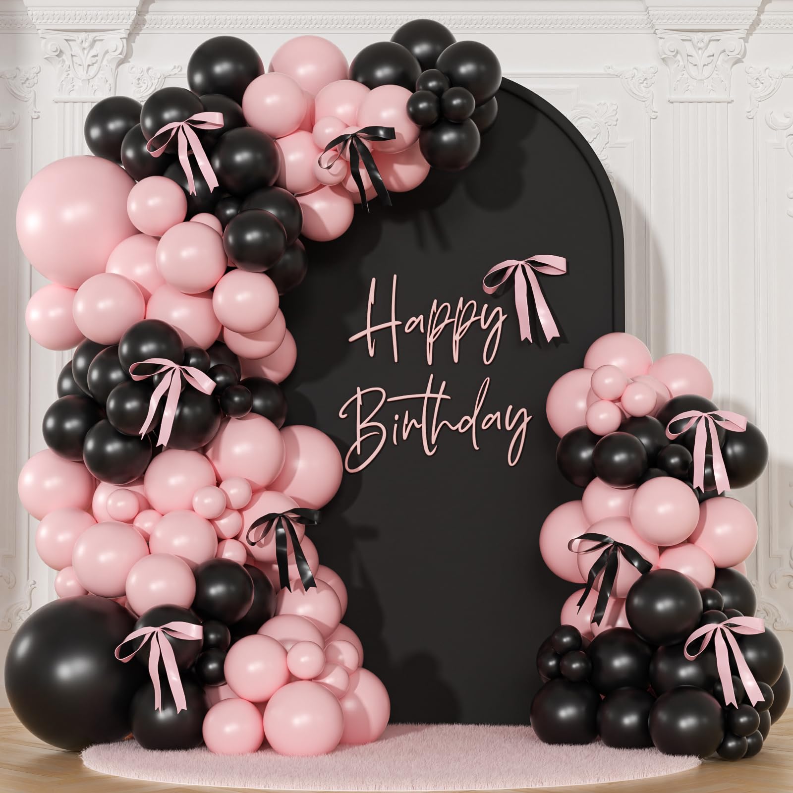 NuttyBash pink and black balloon arch kit setup creates a chic coquette backdrop.