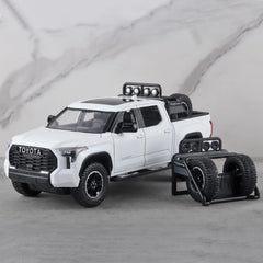 OANMYJJO White Tundra rear view highlights tailgate and wheels.