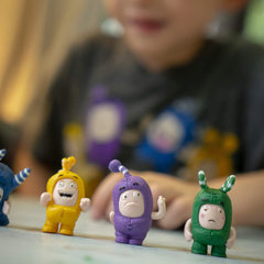 ODDBODS mini figurines collection displayed on shelf as decor
