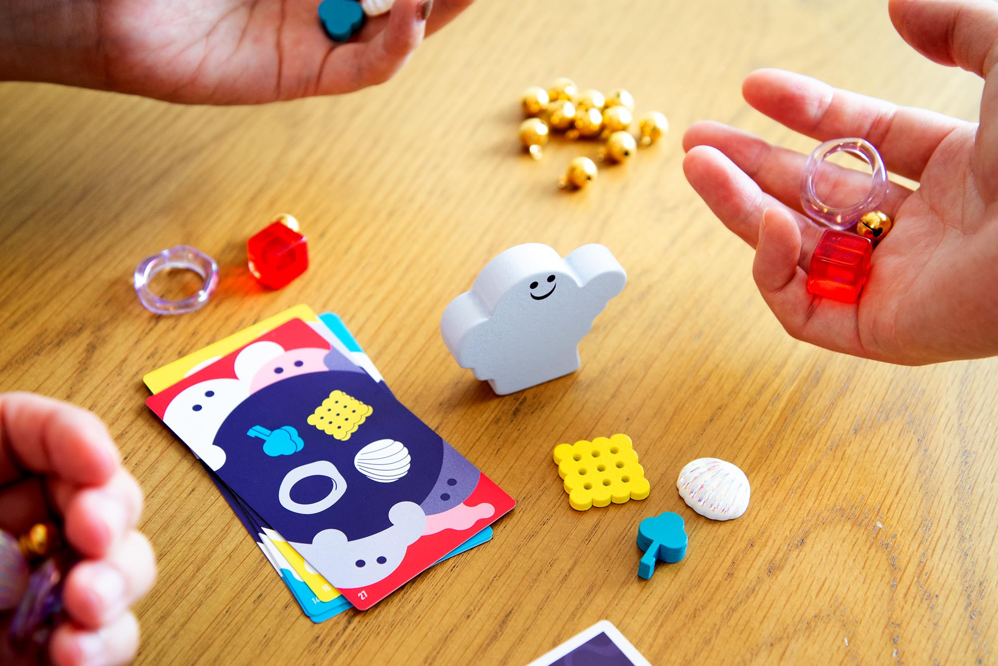 Oink Games DroPolter item tokens close-up highlighting distinct shapes for easier matching benefit