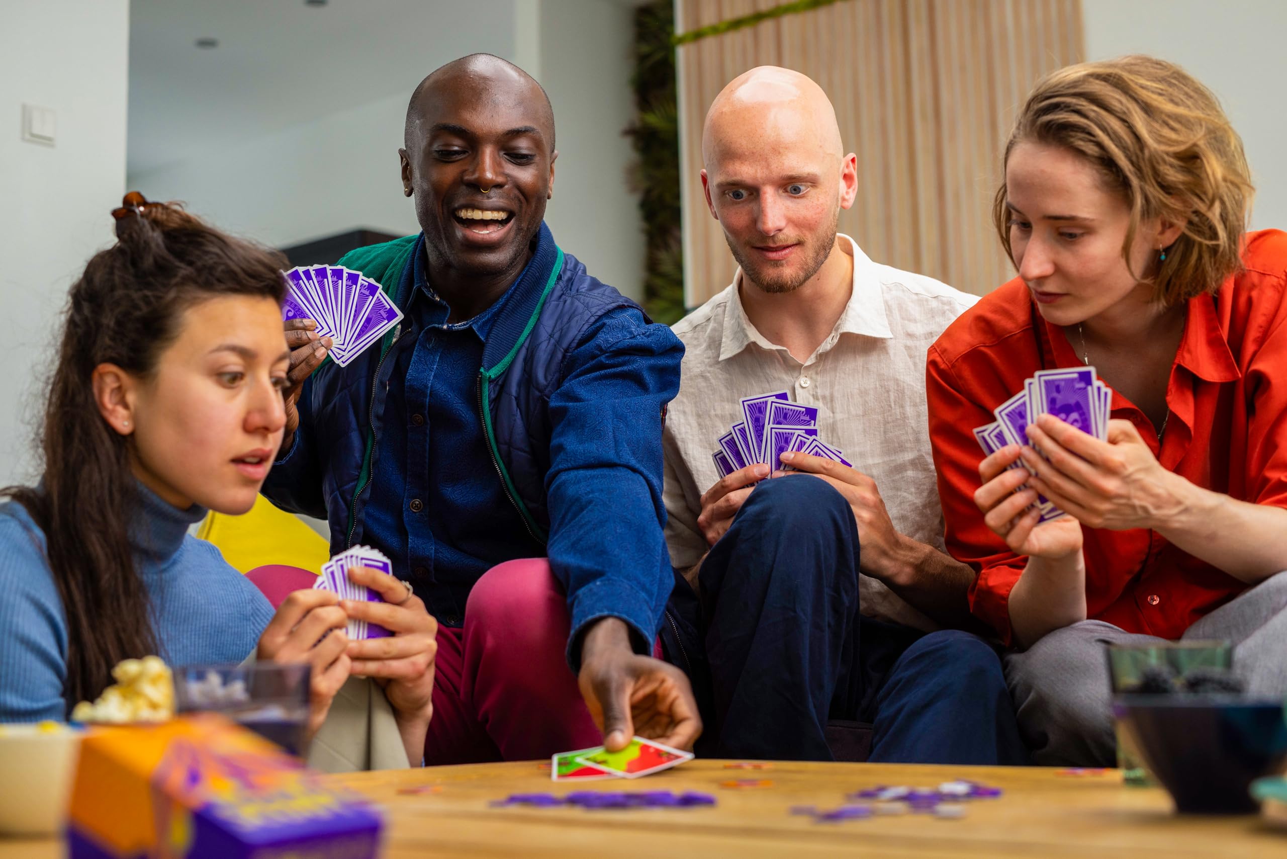 Oink Games Scout player holding cards mid-turn, demonstrating scout-or-show choice