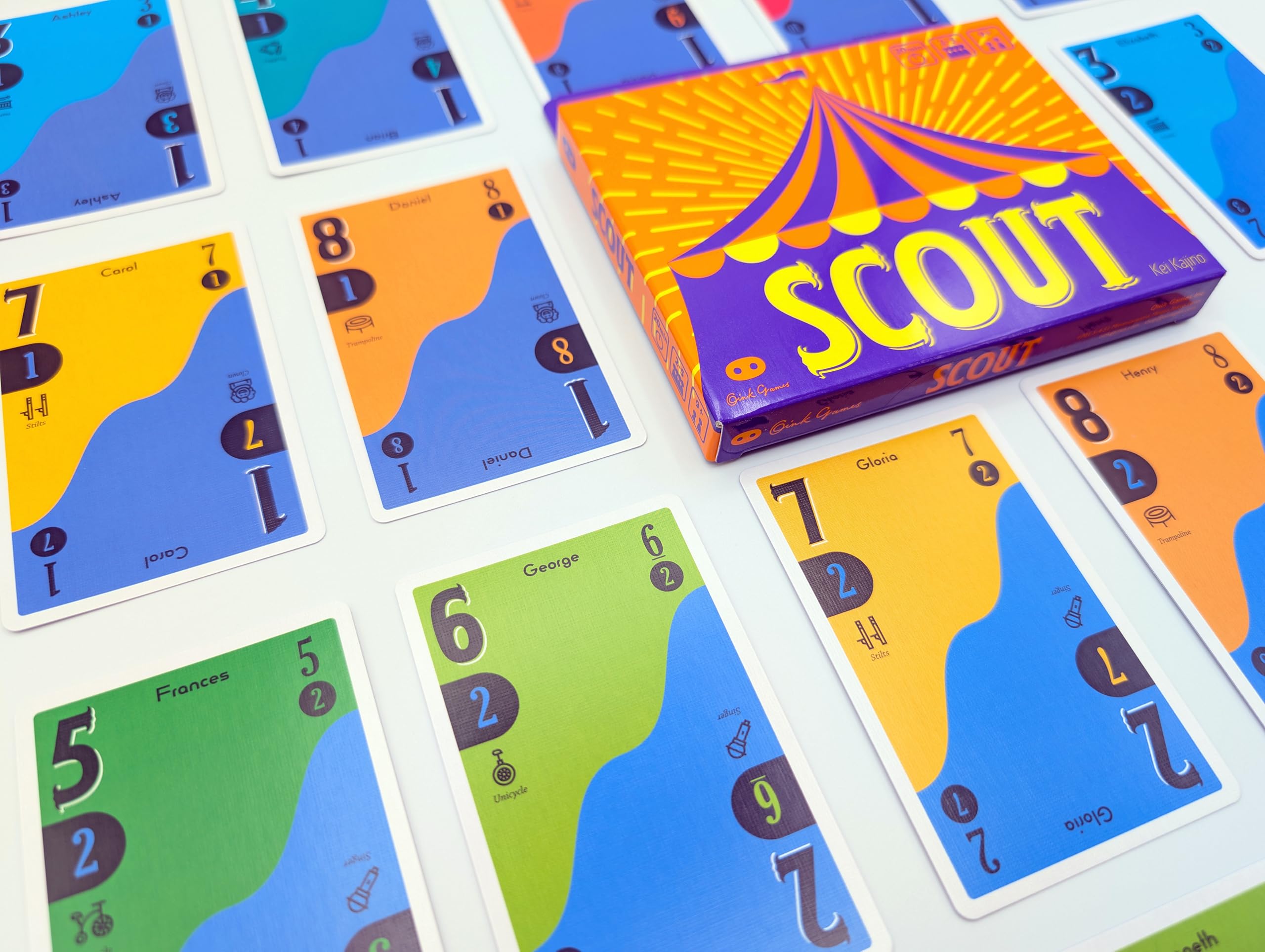 Oink Games SCOUT cards in hand to show scale and travel convenience benefit