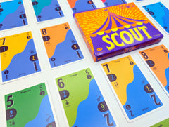 Oink Games SCOUT cards in hand to show scale and travel convenience benefit