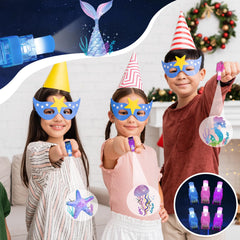 Oitnlaughter glow-in-the-dark finger lights enhance ocean-themed celebrations.