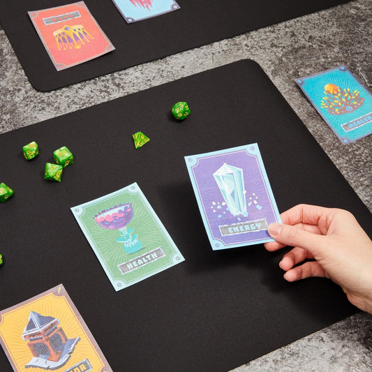 Okuna Outpost playmat adhesive backing keeps secure on smooth tables.