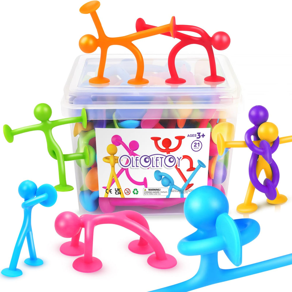OleOletOy suction cup humanoid figure on glass demonstrates strong grip for tactile play